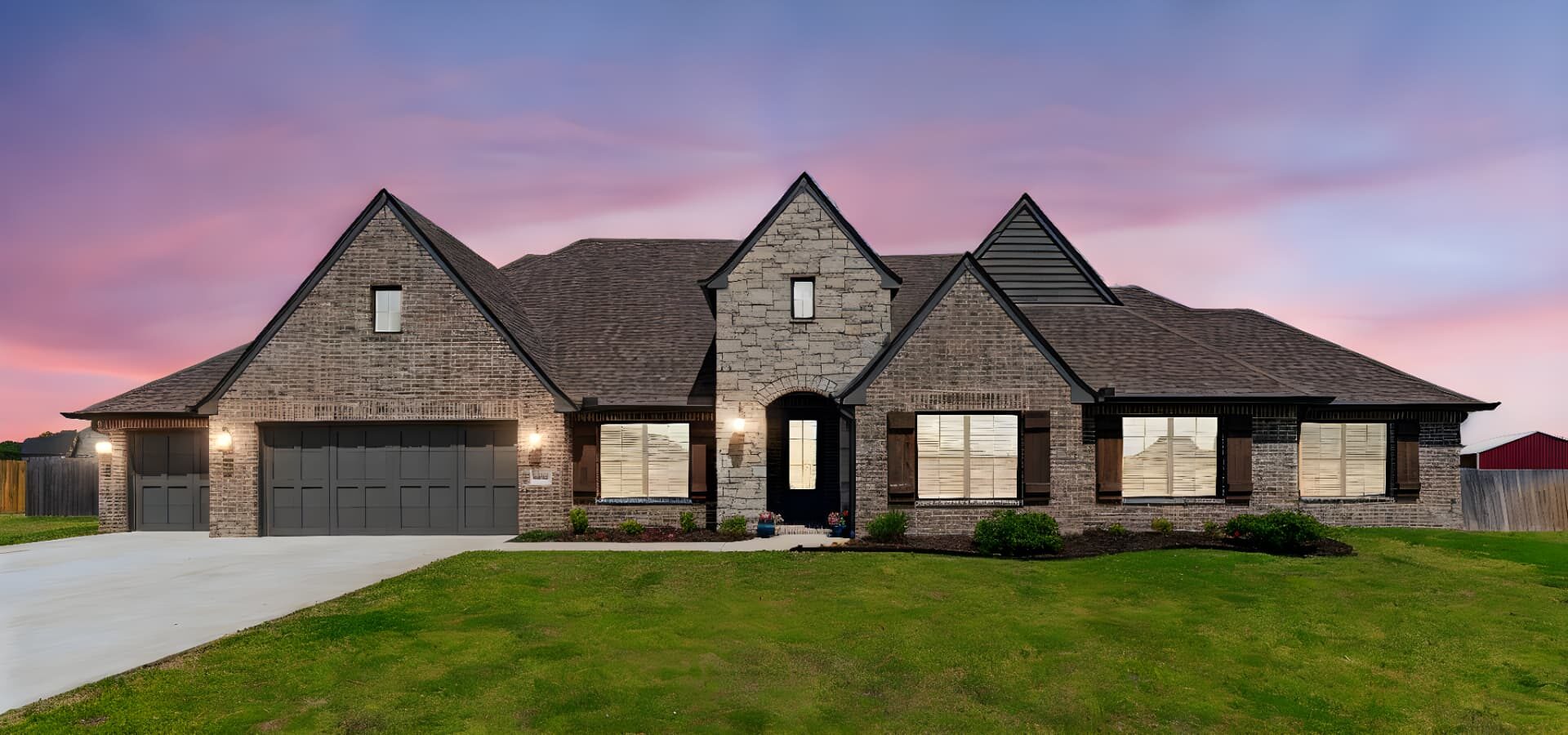 Tudor-style Tulsa home photographed at dusk