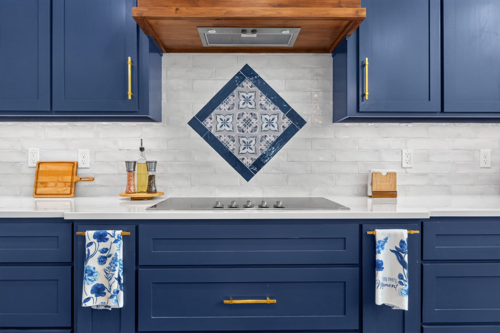 Navy kitchen with brass fixtures photographed for an Oklahoma listing by Killer Visuals