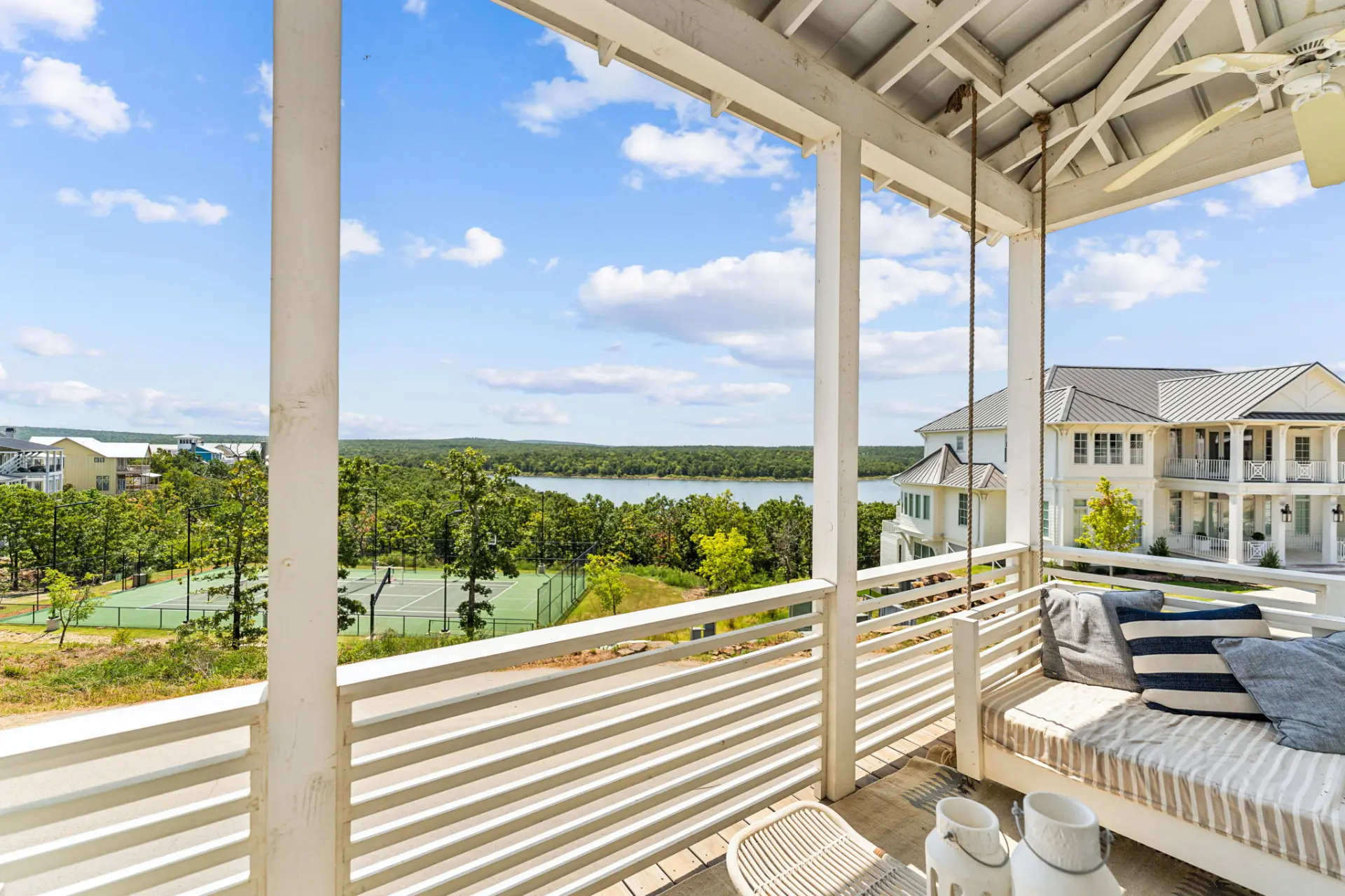 Covered porch overlooking a lake at a luxury property photographed by Killer Visuals