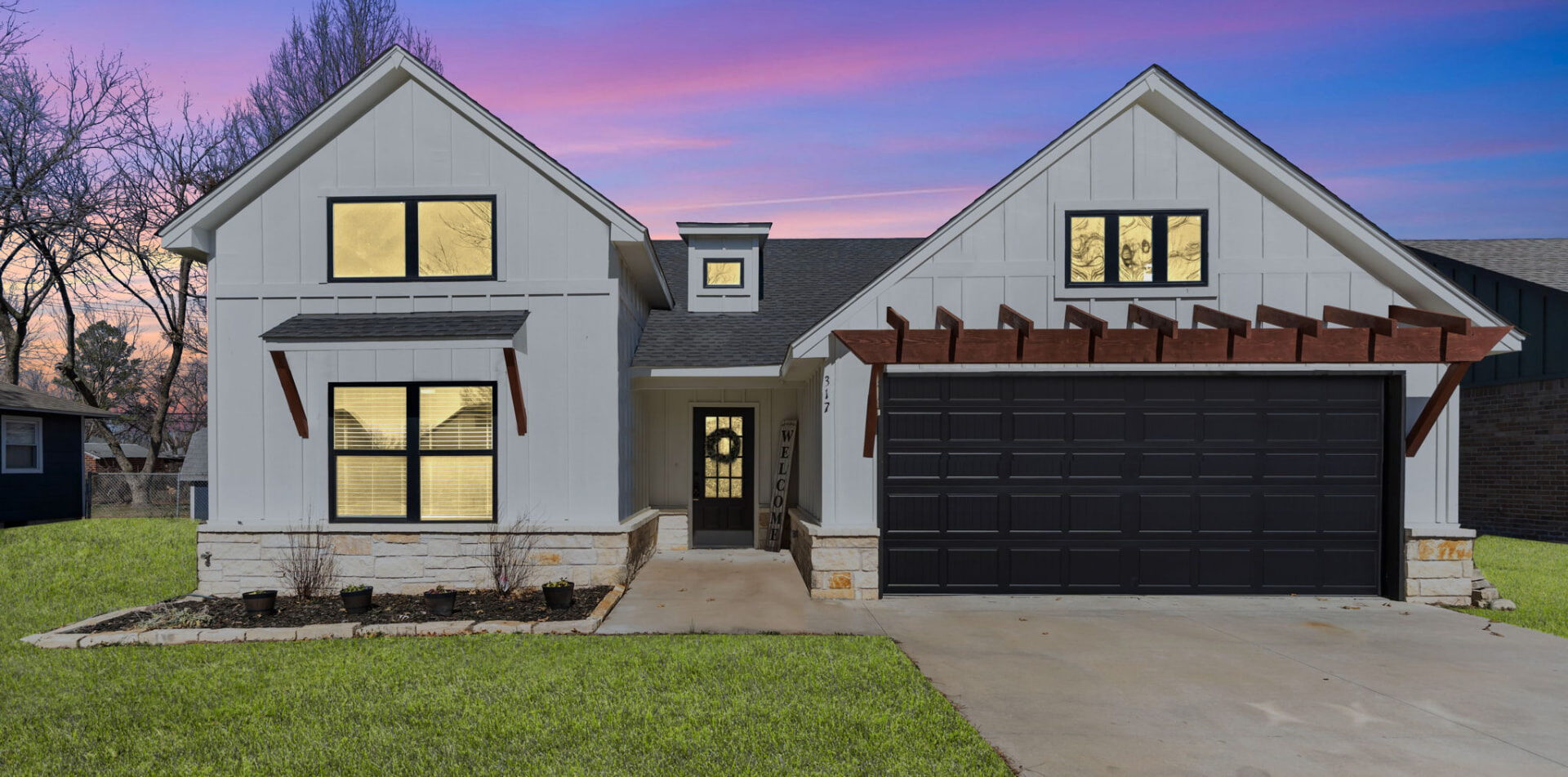 Farmhouse exterior photographed at twilight