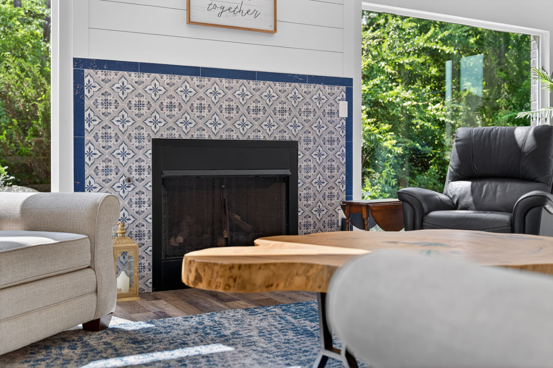 Patterned blue and grey tile fireplace surround detail in an Owasso Oklahoma home