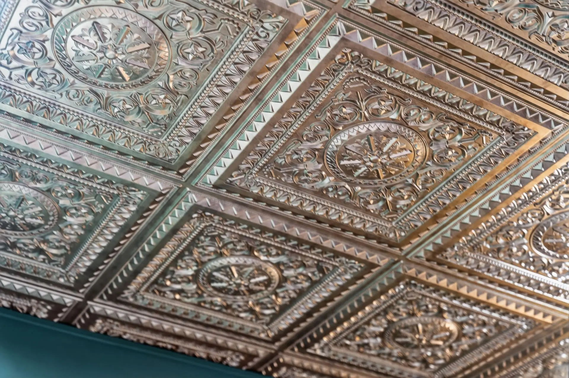 Ornate pressed-metal ceiling detail photographed by Killer Visuals