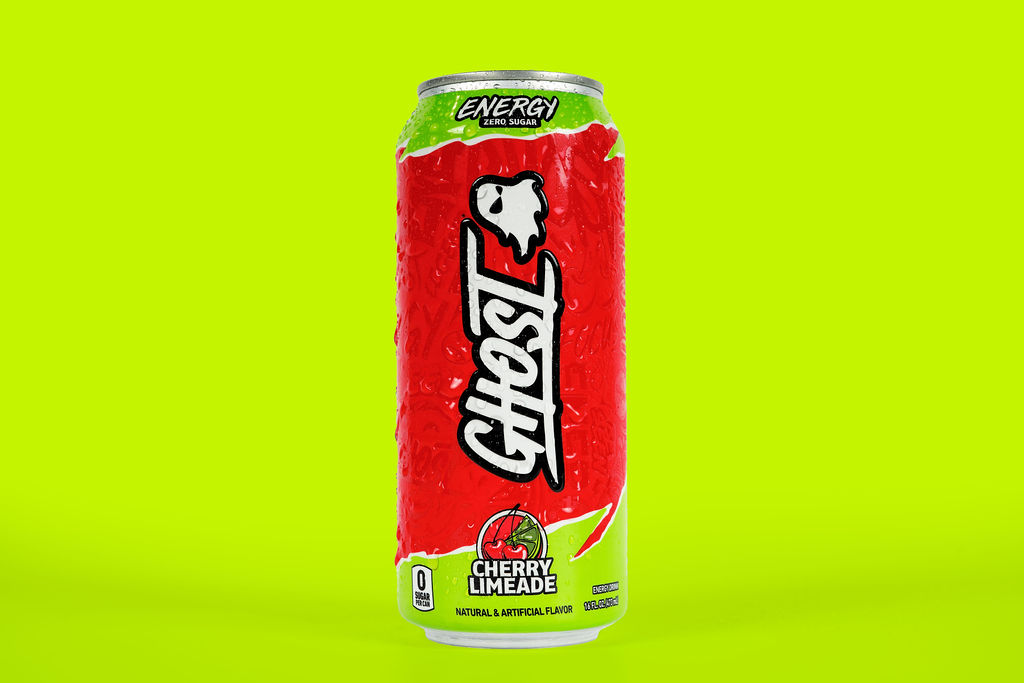 Ghost Energy cherry limeade can photographed on a lime green backdrop